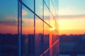 Reflective glass building facade with a blurred sunset in the background view Royalty Free Stock Photo