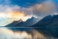 Reflective lake and rocky mountains in Grand Teton National park under the gloomy sky in Wyoming Royalty Free Stock Photo