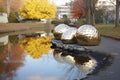 reflective metallic sculptures in an urban park