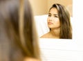 Reflective portrait of young woman mixed race with face emotion Royalty Free Stock Photo