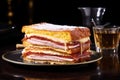 reflective shot of a monte cristo sandwich on a glossy table