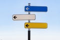 Reflective traffic signal with three direction indicator panels with blue sky. Indicator signal
