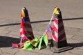 Reflector traffic cones with colored flags on the street Royalty Free Stock Photo