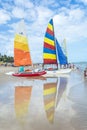 Reflections of four sail boats