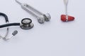 A reflex hammer, tuning fork, stethoscope on white background