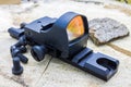 Reflex sight on the stump. Royalty Free Stock Photo