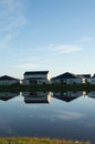 Reflection of new housing unit, in a tropical lake location Royalty Free Stock Photo