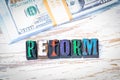 Reform concept. Wooden letters on the office desk