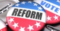 Reform and elections in the USA, pictured as pin-back buttons with American flag colors, words Reform and vote, to symbolize that Royalty Free Stock Photo