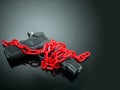 reform gun control concept. red chain around handgun on black mirror with spotlight shine to the gun Royalty Free Stock Photo