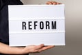 Reform. Text in light box. Medicine, education and economics concept