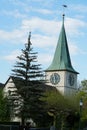 Reformed church in Schlieren, Switzerland, surrounded by trees of a nearby park