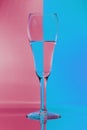 Refraction of light by a glass on a red and blue squared background. Abstract glass art Royalty Free Stock Photo