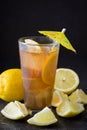 Refresh Ice tea with lemon. Black stone background Royalty Free Stock Photo