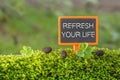 Refresh your life text on small blackboard