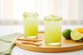 refreshing agua fresca in a glass with sliced cucumbers