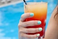 refreshing alcoholic beverahe in glass at pool. mixology and bartender. summer lifestyle. summer beach cocktail. summer vacation