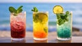 Refreshing alcoholic cocktails with ice, mint and fruit on the bar in close-up against the sea. Sunset. Party Royalty Free Stock Photo