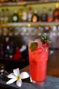 refreshing alcoholic drink with fruits, chilled vodka and gin, lemon peel served in glass tumbler