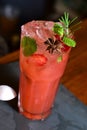 refreshing alcoholic drink with fruits, chilled vodka and gin, lemon peel served in glass tumbler