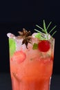 refreshing alcoholic drink with fruits, chilled vodka and gin, lemon peel served in glass tumbler