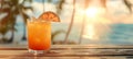 Refreshing bahama mama cocktail in tropical paradise with copy space