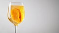 Refreshing Bellini Cocktail in Clear Glass with Peach Puree and Bubbles on White Background Royalty Free Stock Photo