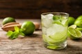 Refreshing beverage with mint and lime in glass on table Royalty Free Stock Photo