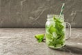 Refreshing beverage with mint and lime in mason jar