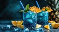 Refreshing blue cocktails with pineapple garnish and mint leaves on ice Royalty Free Stock Photo