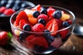 Refreshing bowl of fruit salad filled with juicy strawberries