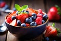 Refreshing bowl of fruit salad filled with juicy strawberries and vibrant blueberries