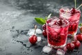 Refreshing Cherry Soda with Ice and Fresh Cherries on Dark Background