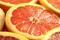 Refreshing citrus slices, up-close look at juicy grapefruit segments Royalty Free Stock Photo