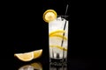 Refreshing classic Tom Collins or Whiskey sour cocktail with a maraschino cherry and lemon slice on black background Royalty Free Stock Photo