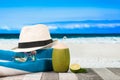 Refreshing cocktail on beach table. Vacation at Paradise