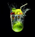 Refreshing cocktail in imaginary glass out of water splashes on black background Royalty Free Stock Photo