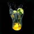 Refreshing cocktail in imaginary glass out of water splashes on black background Royalty Free Stock Photo