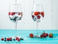 Refreshing cocktail with martini with ice and berries on wood table Royalty Free Stock Photo