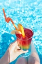 Refreshing cocktail near swimming pool, close up Royalty Free Stock Photo