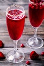 Refreshing cocktail with sparkling wine and cranberry for Valentine`s day Royalty Free Stock Photo