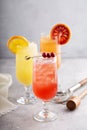 Refreshing cocktails or mocktails with oranges and cranberries Royalty Free Stock Photo