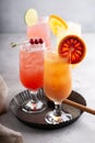 Refreshing cocktails or mocktails with oranges and cranberries Royalty Free Stock Photo