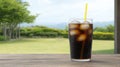 Refreshing cola drink with ice on a summer day.