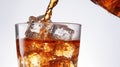 Refreshing cola pour with bubbles and ice on white fast food unhealthy high calorie