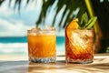 Refreshing Cold Beverages in Glassware with Ice and Fruit on Beach Background Royalty Free Stock Photo