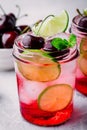 Refreshing cold summer drink cherry and lime lemonade