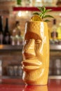 Refreshing cold Tiki cocktail on the bar. Summer party background Royalty Free Stock Photo