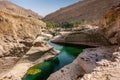 The refreshing cold water of the oasis of Wadi Bani Khalid in Om Royalty Free Stock Photo