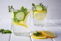 Refreshing cucumber cocktail, lemonade, detox water in a glasses on a white background. Royalty Free Stock Photo